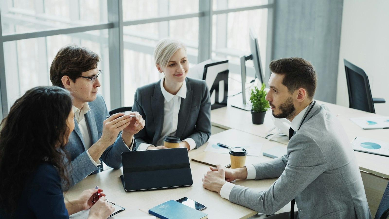 A leadership team working together around a conference table