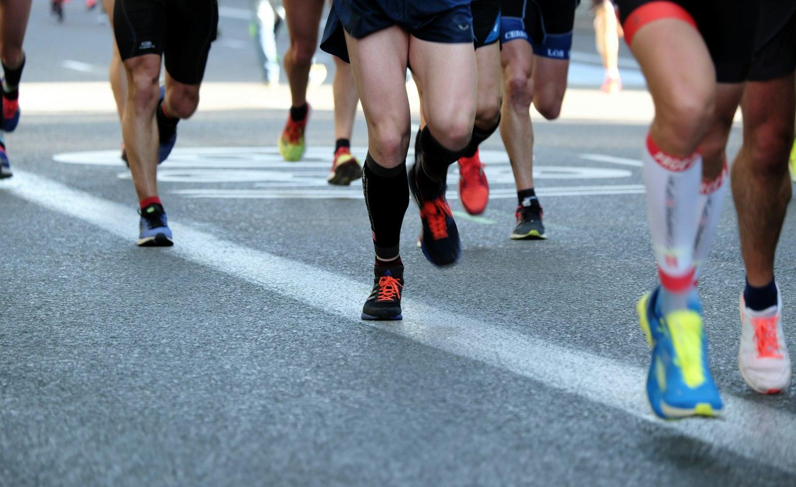 Runners racing on a city street