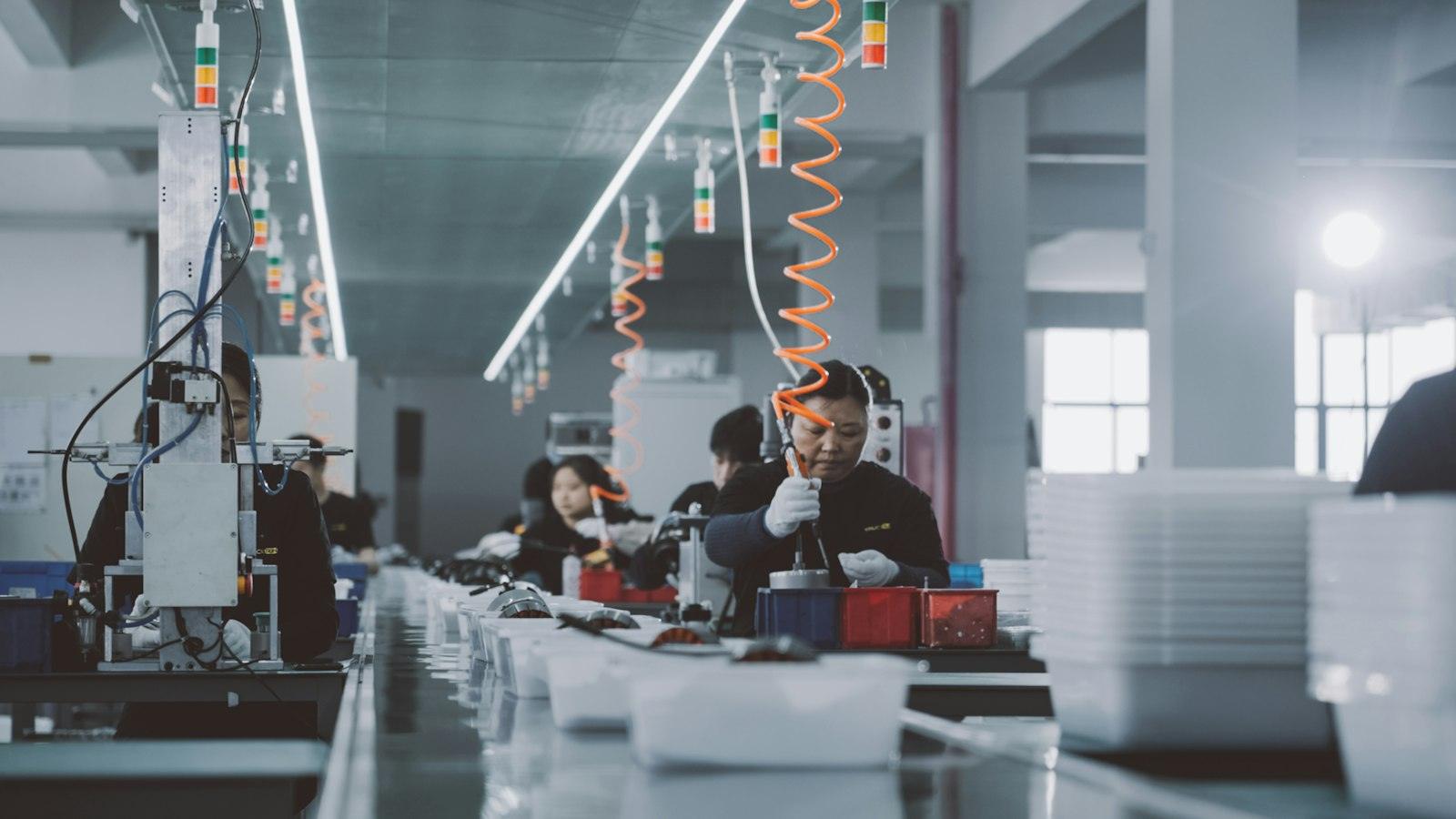 A modern production floor with teams at work